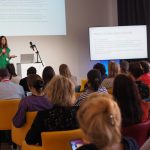 A woman speaking at the conference