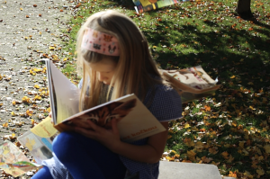 Little girl reading a book